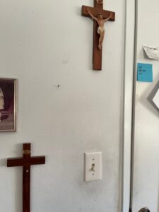 Crucifixes, one with a missing Jesus.