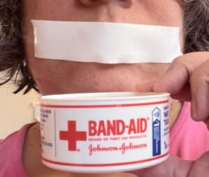 Mouth taped with Band-Aid medical tape