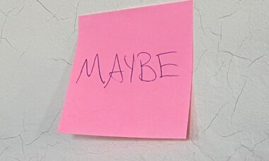 Pink post-it that says "Maybe"